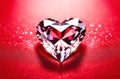 Large shining diamond in the shape of heart on red background. Gemstone, crystal on red velvet