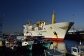 A large ship and fishing boats at the pier in the port of Valparaiso. Chili