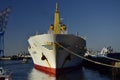 A large ship and fishing boats at the pier in the port of Valparaiso. Chili