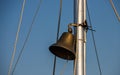 Large ship's bell with large clapper on a cruise ship at blue sky Royalty Free Stock Photo