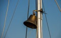 Large ship's bell with large clapper on a cruise ship at blue sky Royalty Free Stock Photo