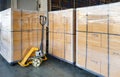 Large shipment package boxes wrapping plastic on pallets. Interior of warehouse storage