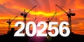 Construction cranes and buildings at sunset with large white numbers 2056 Keywords: construction Royalty Free Stock Photo