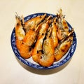 Large shrimp grilled in a blue plate Royalty Free Stock Photo