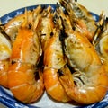 Large shrimp grilled in a blue plate Royalty Free Stock Photo