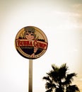 a large sign above a palm tree advertising bubba gump shrimp