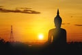 The large Silhouette Buddha on golden sunset background. Sky morning in Asia Thailand Royalty Free Stock Photo