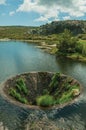 Large sinkhole in a dam lake on the highlands Royalty Free Stock Photo