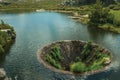 Large sinkhole in a dam lake on the highlands Royalty Free Stock Photo