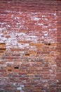 Old ruined brick wall texture, potholes and cement clay