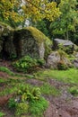 Large and small boulders create a beautiful composition in the form of a grotto cave.