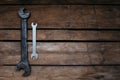 large and small, old and new, two wrenches on wooden background, copy space Royalty Free Stock Photo