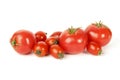 Large and small red tomatoes on a white background Royalty Free Stock Photo