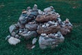 large and small rough texture stones stand on top of each other in a pile of moss Royalty Free Stock Photo
