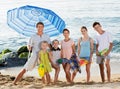 Large smiling family standing together on beach on summer day Royalty Free Stock Photo