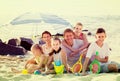 Large smiling family of six people together on beach Royalty Free Stock Photo