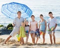 Large smiling family standing together on beach on summer day Royalty Free Stock Photo