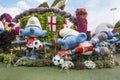 Large Smurfs dolls in clothes of national football teams from World Cup in botanical Dubai Miracle Garden in Dubai city, United