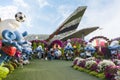 Large Smurfs dolls in clothes of national football teams from World Cup in botanical Dubai Miracle Garden in Dubai city, United