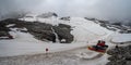 A large snow tarpaulin protecting the ice of the Hintertux glacier in the Alps, a ski slope is leading in between Royalty Free Stock Photo