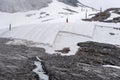 A large snow tarpaulin protecting the ice of the Hintertux glacier in the Alps, a ski slope is leading in between Royalty Free Stock Photo