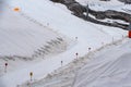 A large snow tarpaulin protecting the ice of the Hintertux glacier in the Alps, a ski slope is leading in between Royalty Free Stock Photo