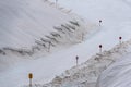 A large snow tarpaulin protecting the ice of the Hintertux glacier in the Alps, a ski slope is leading in between Royalty Free Stock Photo