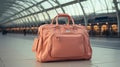 AI Generated. A large soft-shaped travel bag, soft pink, stands on the station platform.