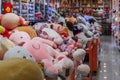 Large soft stuffed plush toys in bins and on shelves on display for sale at a toy store in Chinatown Singapore