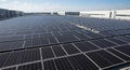 Large Solar Panel Array on Modern Commercial Roof Royalty Free Stock Photo