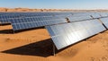Vast solar panel installation in a desert landscape with sand dunes under a clear blue sky and bright sunlight Keywords: solar Royalty Free Stock Photo