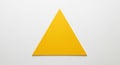 A large, solid yellow equilateral triangle centered on a plain Royalty Free Stock Photo