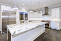 Large, spacious kitchen design with white kitchen cabinets Royalty Free Stock Photo