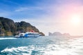 Large speed boat blue. Sailing on the Andaman Sea on a sunny day leaving behind a trail and waves on the water Royalty Free Stock Photo