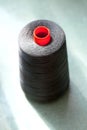 Large Spool of Black Thread on Table