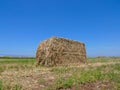 Large square Hay Bale in a field. Royalty Free Stock Photo
