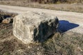 Large square stone on the edge of the road Royalty Free Stock Photo