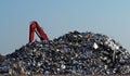 Large stack of aluminum and ferrous materials scrap ready for recyclingshines under the sun.