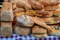 Large stack of artisan bread standing on counter Royalty Free Stock Photo