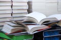 stack of books, close up. Open book on the table in library. Back to school concept. Royalty Free Stock Photo