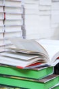 stack of books, close up. Open book on the table in library. Back to school concept. Royalty Free Stock Photo