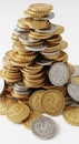 A large stack of gold and silver coins is arranged in a pyramid shape. The coins Royalty Free Stock Photo