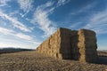 Large stack of hay bales.