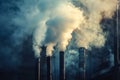 Large stack of smokestacks billowing smoke into the sky Royalty Free Stock Photo