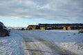 Large Stacks of Hay Bails on a Snowy Farm Field in Winter Royalty Free Stock Photo