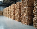 Large stacks of recycled paper bales in processing facility for sorting repurposing. Eco-friendly, sustainable waste management. Royalty Free Stock Photo