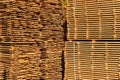 Large stacks of wooden planks at the sawmill yard. Sawing drying and marketing of wood. Pine lumber