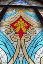 large stained glass window with colored patterned glass