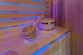 Large standard design classic wooden russian bath sauna interior with hot stones Royalty Free Stock Photo