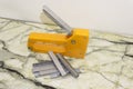 Large stapler and staples for construction work on white Royalty Free Stock Photo